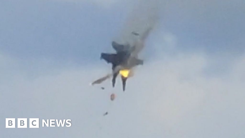 Moment two fighter jets collide mid-air at US air show
